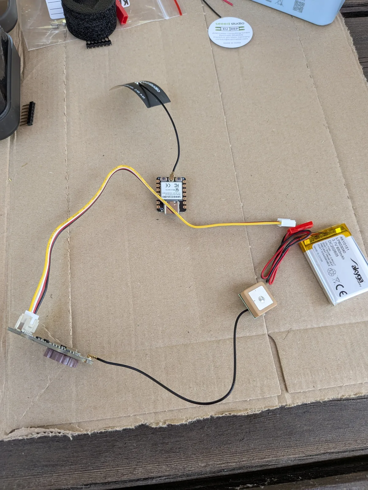 CatTracker prototype with ESP32-C3, GNSS module, antennas, and Li-Po battery