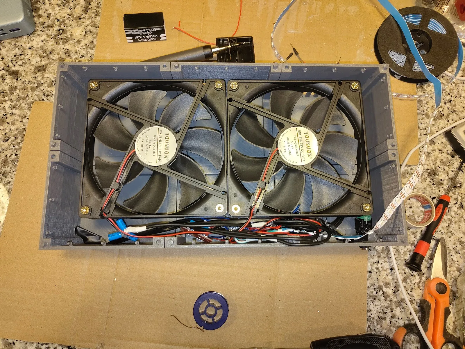Fan assembly and electronics inside the fireplace
